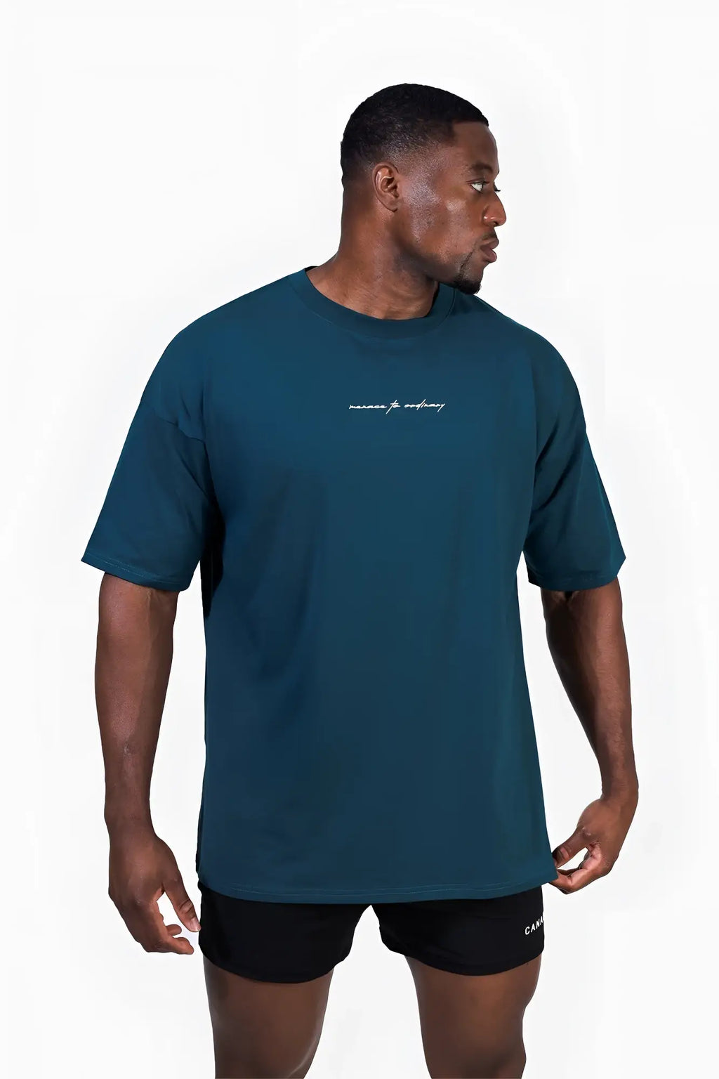 Energy oversized t-shirt in teal with short sleeves crew neck and white subtle cursive logo on the chest
