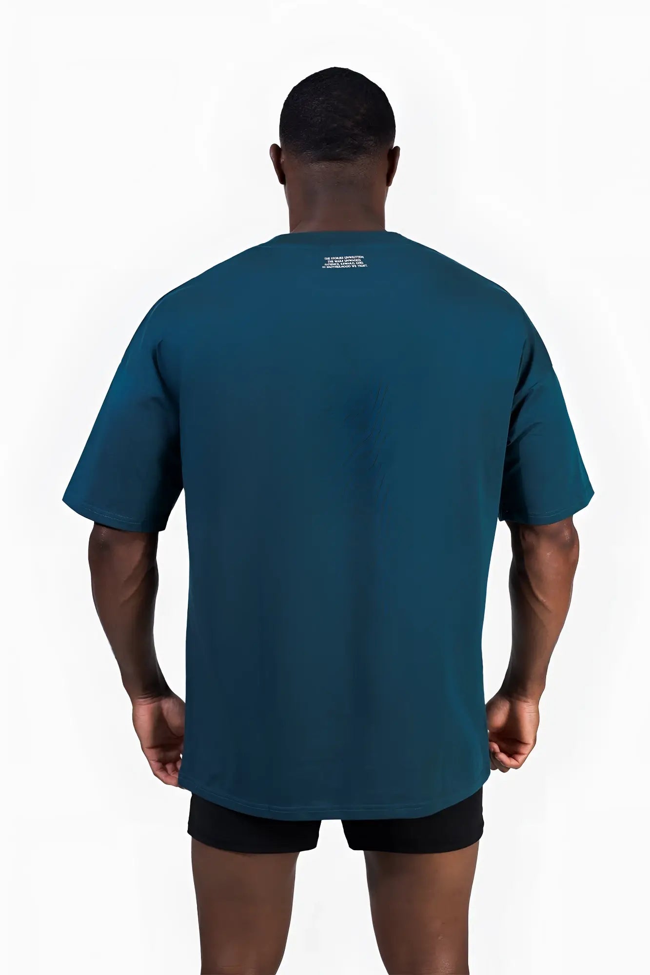 Energy oversized t-shirt in teal with a subtle white text logo at the neckline and short sleeves