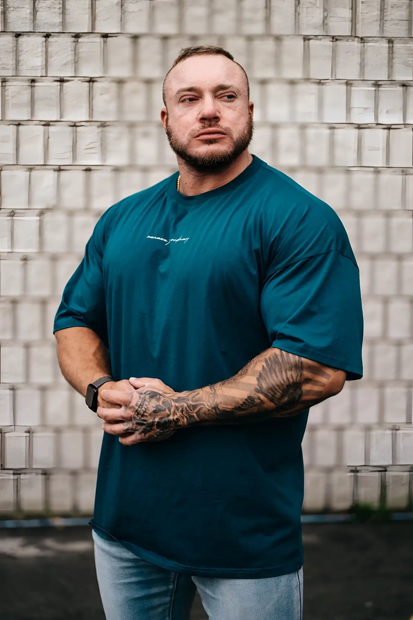 Energy oversized t-shirt in teal with subtle white chest embroidery made from soft breathable fabric