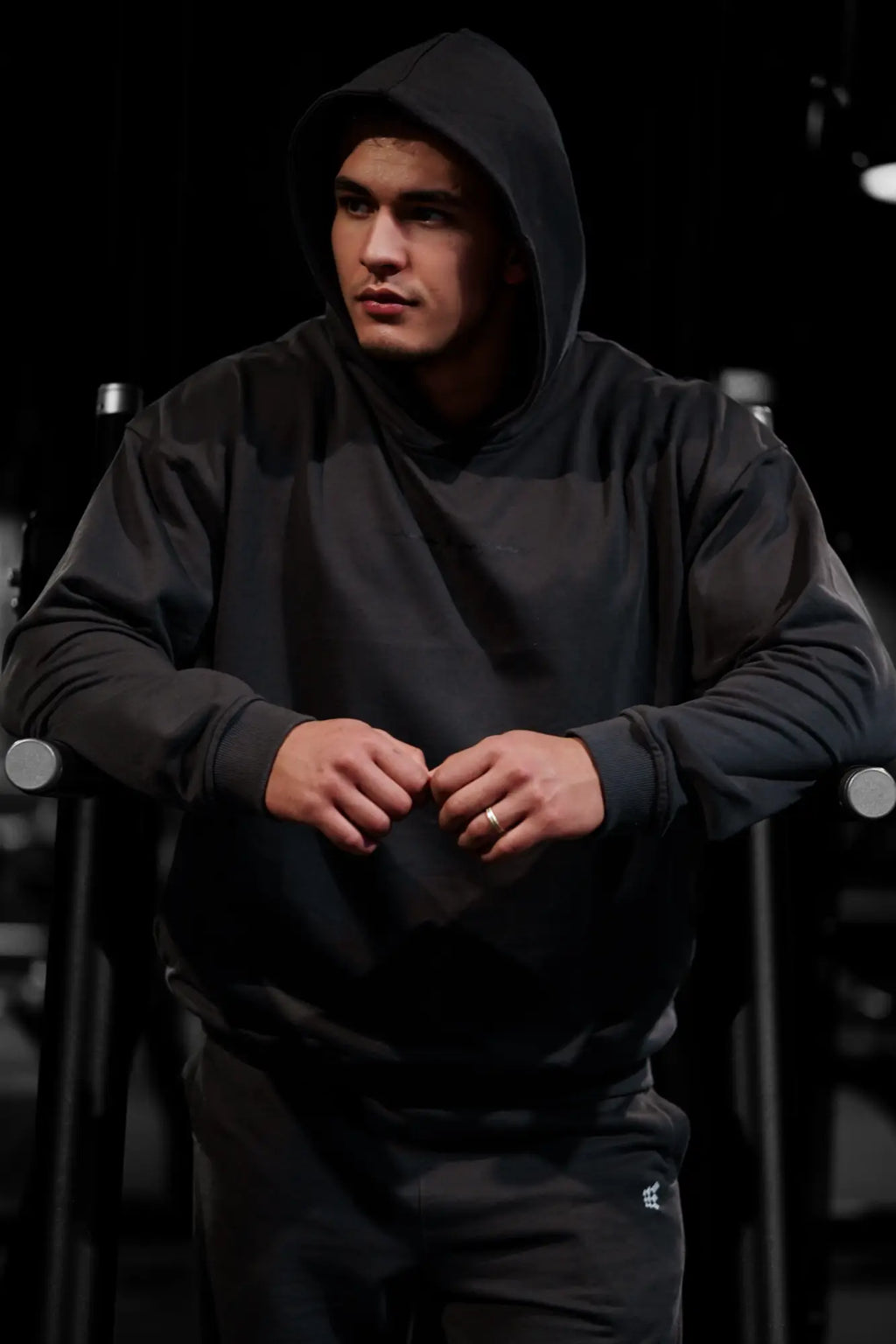 Black hooded sweatshirt by Jed North Essentials with relaxed fit ribbed cuffs in dark gray cotton blend fabric