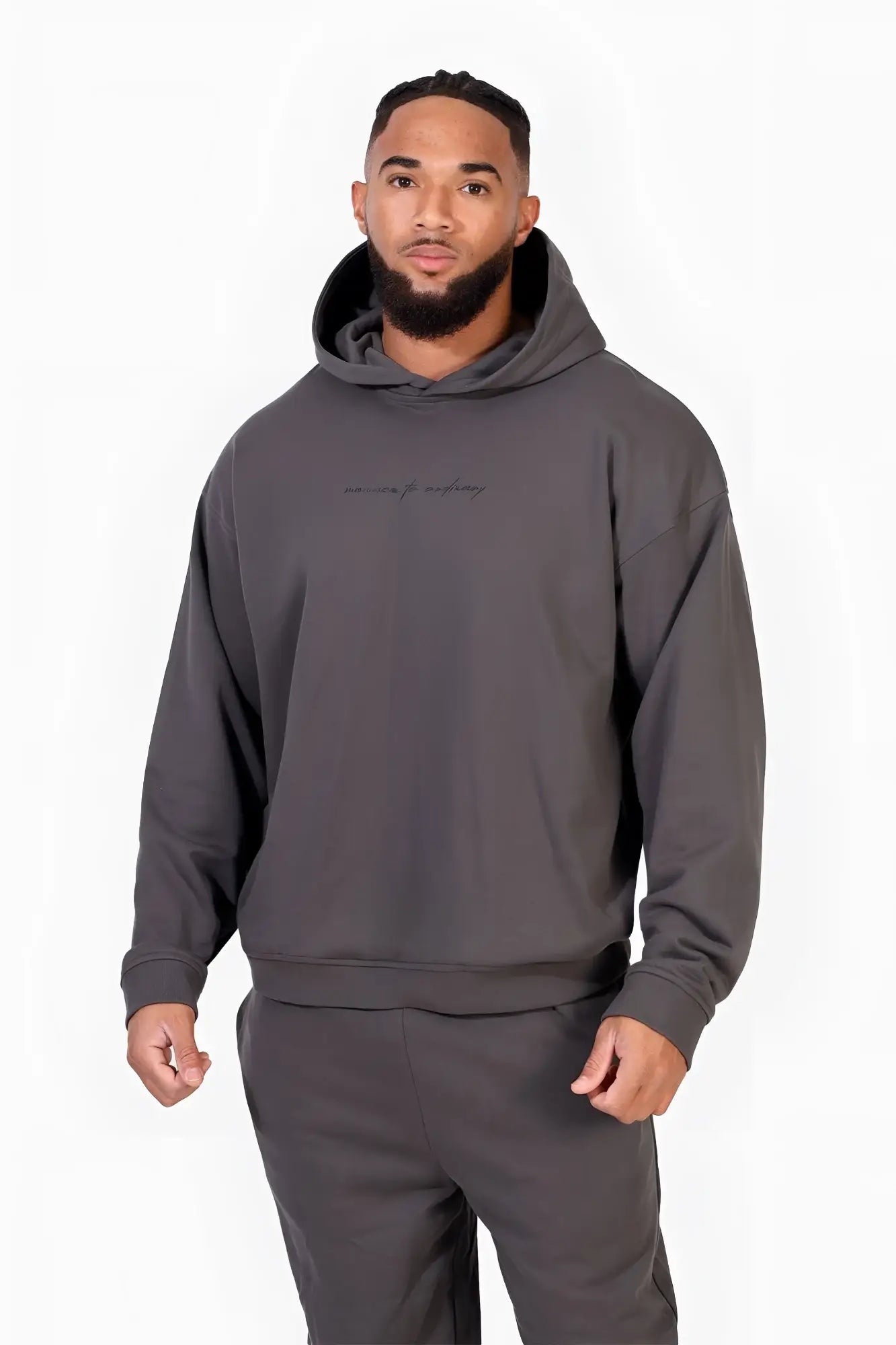 Dark gray oversized hoodie by jed north with a subtle embroidered logo across the chest for casual wear