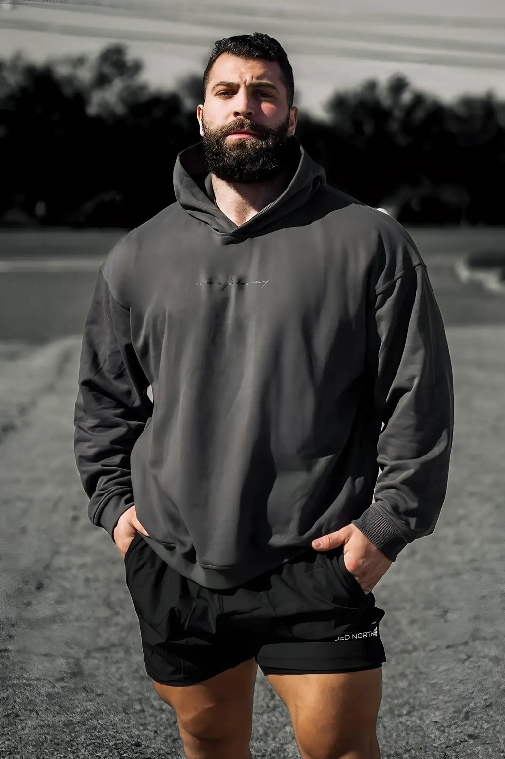 Dark gray oversized jed north essentials relaxed hoodie with subtle embroidered logo on the chest