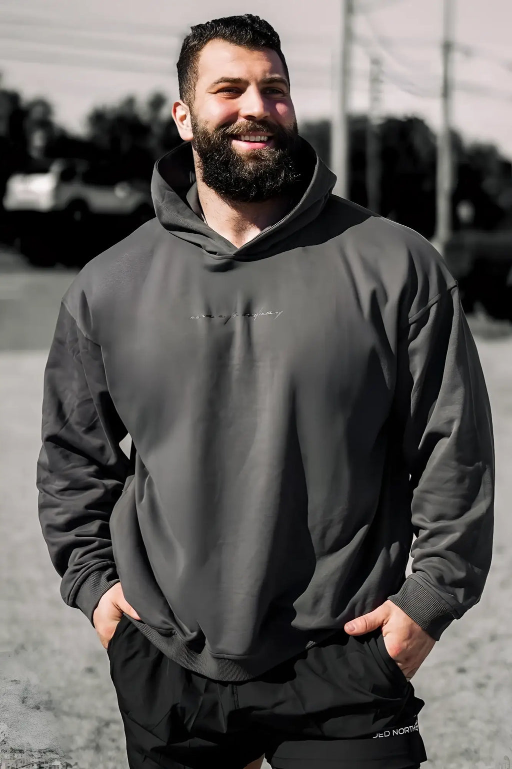 Dark gray jed north essentials relaxed hoodie with subtle embroidered logo on chest in oversized fit