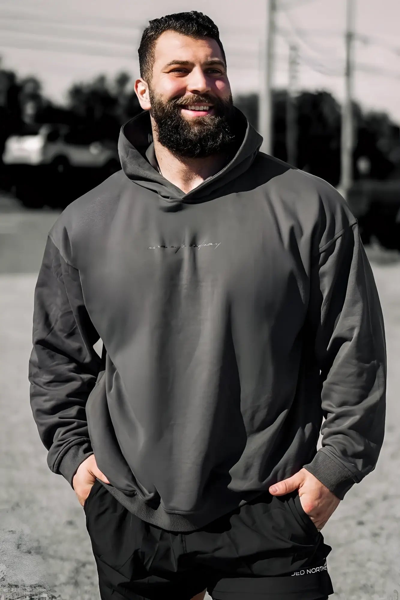 Dark gray jed north essentials relaxed hoodie with subtle embroidered logo on chest in oversized fit