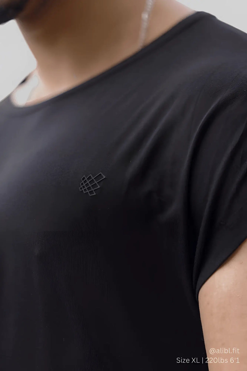 Black cotton jed north evolve cap sleeve muscle t shirt 2.0 with subtle geometric logo embroidered on left chest