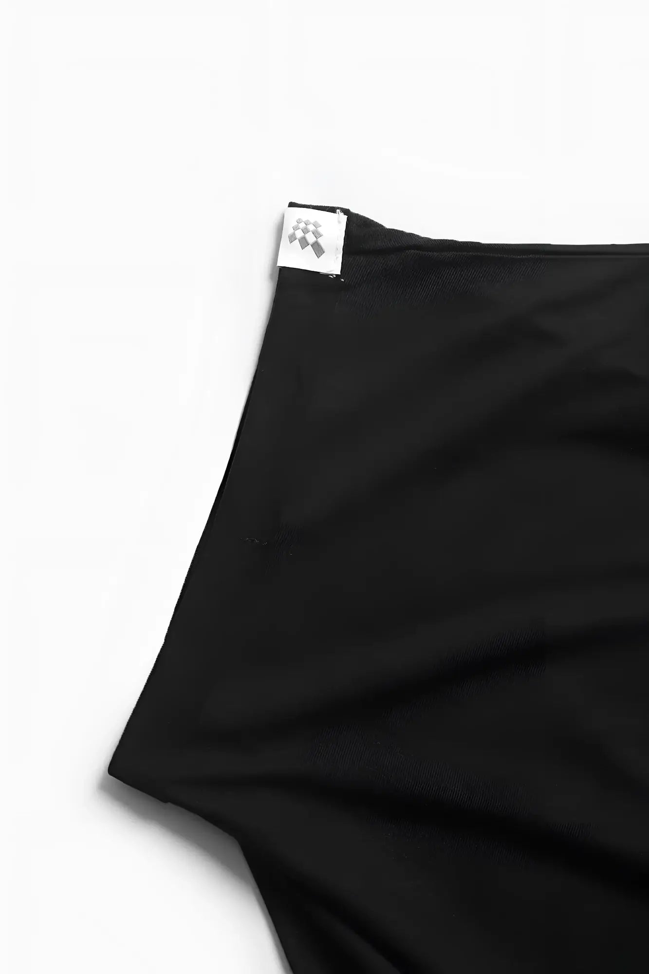 Black Jed North evolve cap sleeve muscle t-shirt 2.0 fabric with small white label and checkered logo at hem