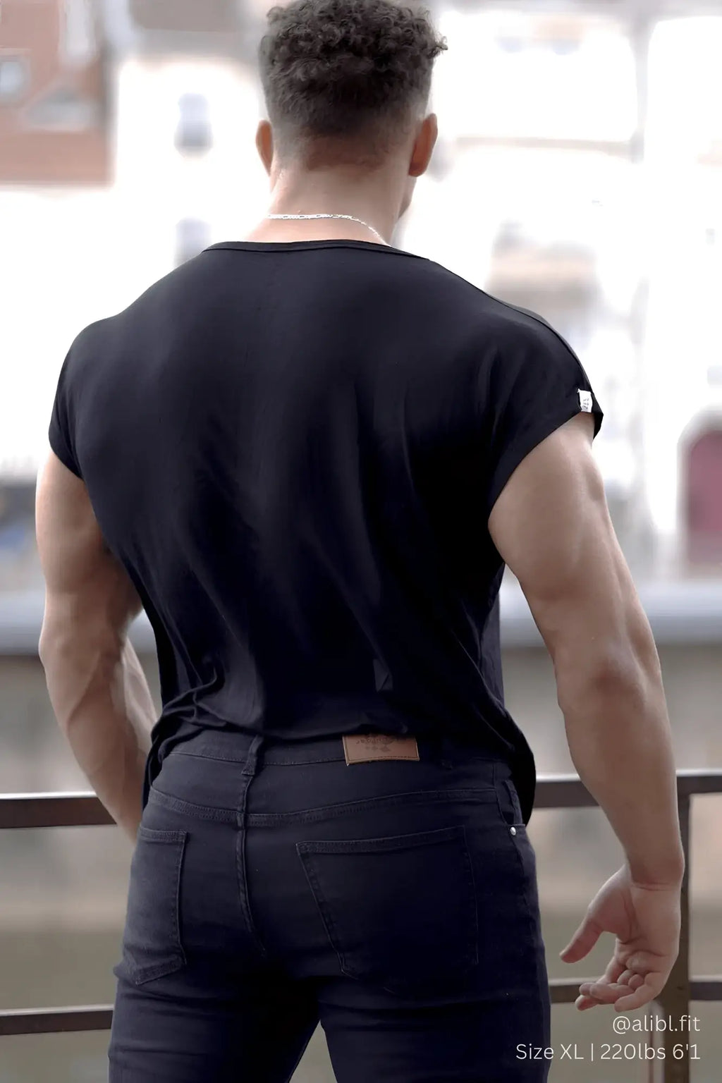 Black sleeveless cotton jed north evolve cap sleeve muscle t shirt 2.0 with small white logo on the shoulder
