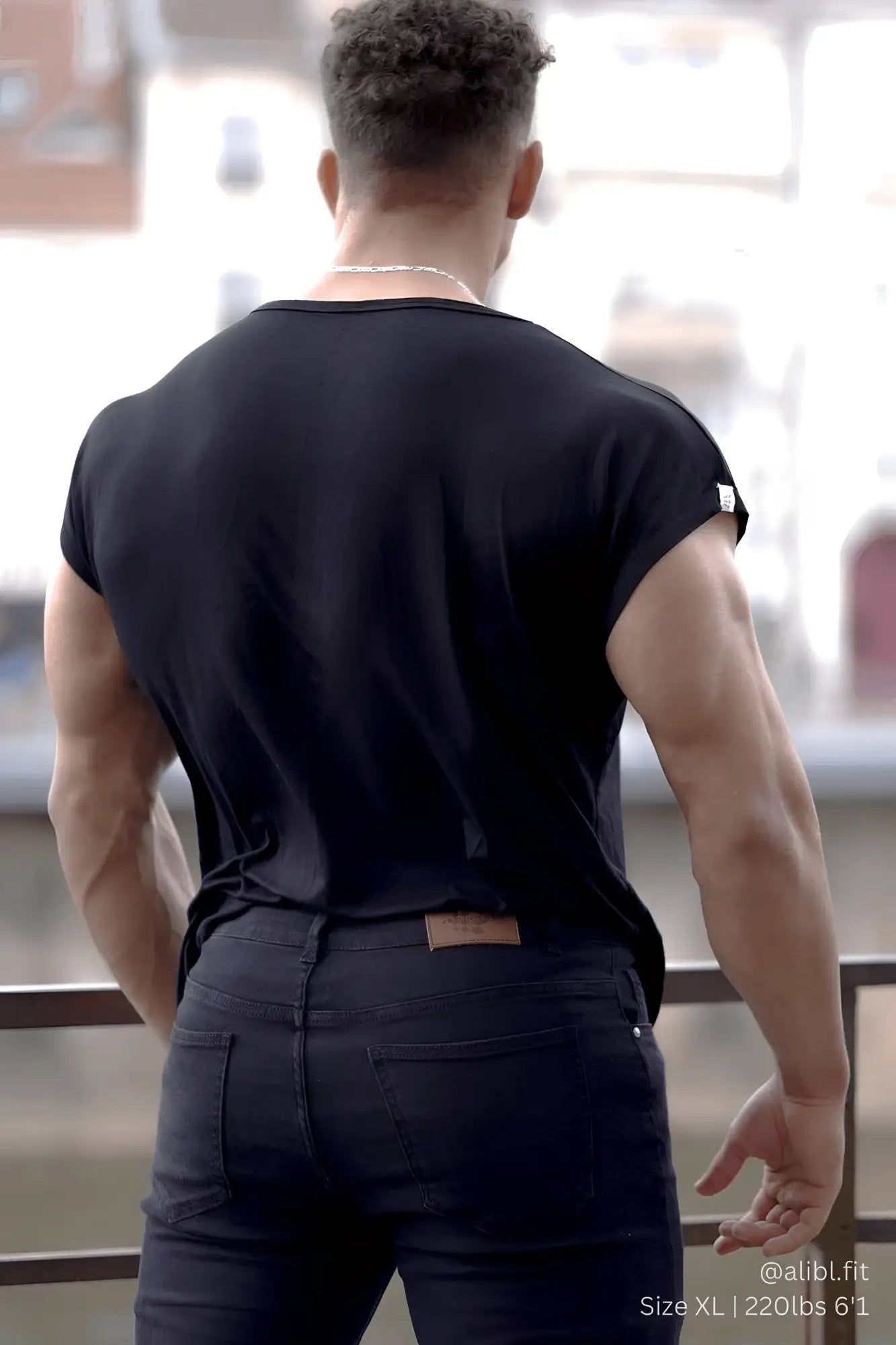 Black sleeveless cotton jed north evolve cap sleeve muscle t shirt 2.0 with small white logo on the shoulder