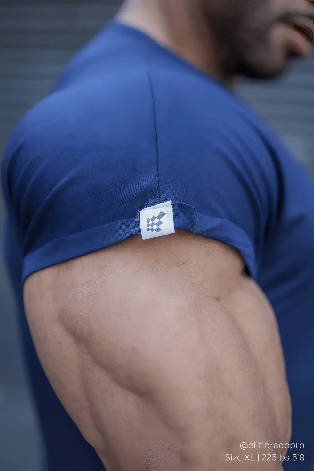Jed North evolve cap sleeve muscle t-shirt 2.0 navy blue athletic shirt with small white tag and black checkered logo on shoulder seam