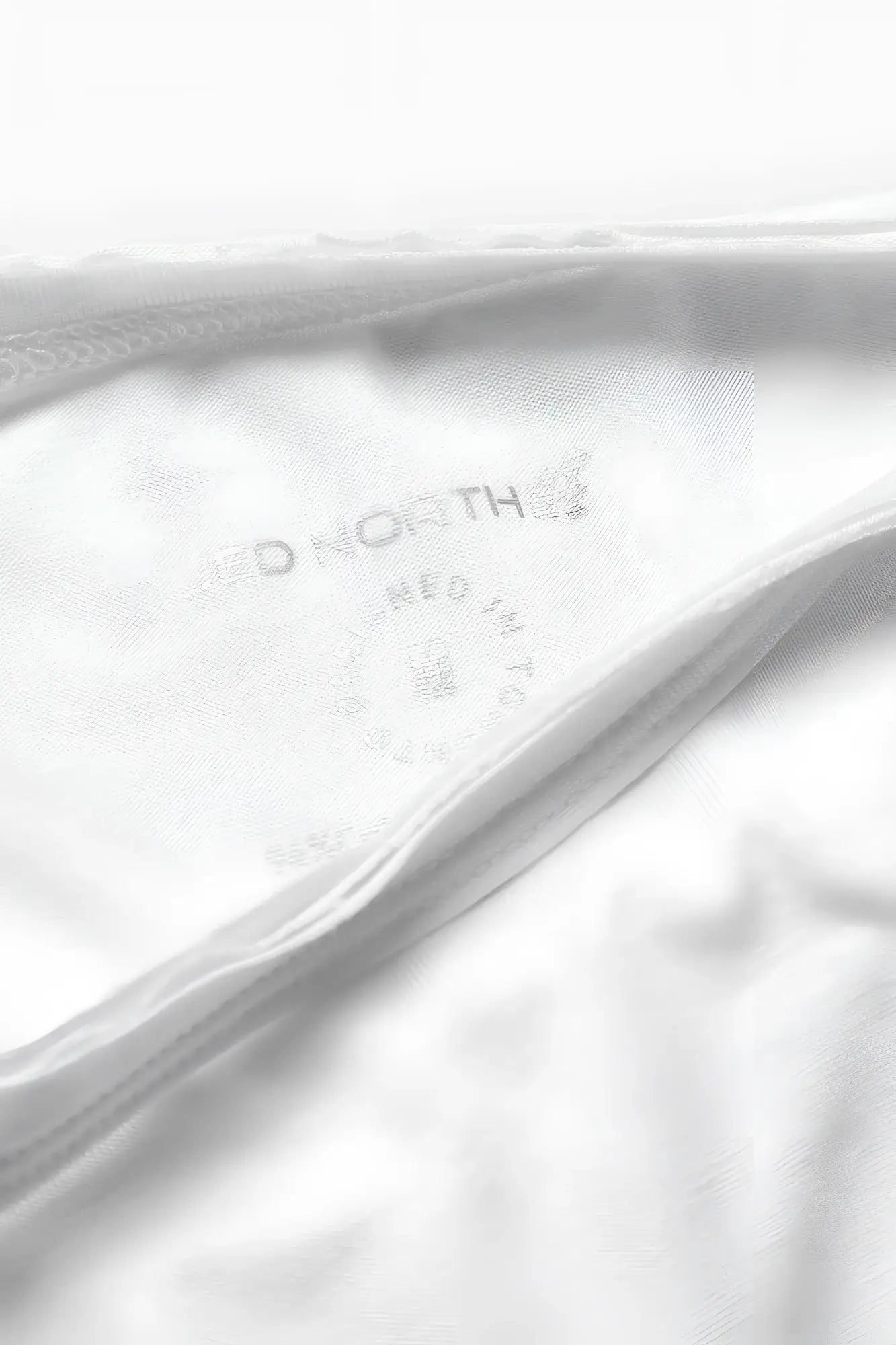 White cotton garment tag with aeropostale embossed branding on the jed north evolve cap sleeve muscle t shirt 2.0 off white