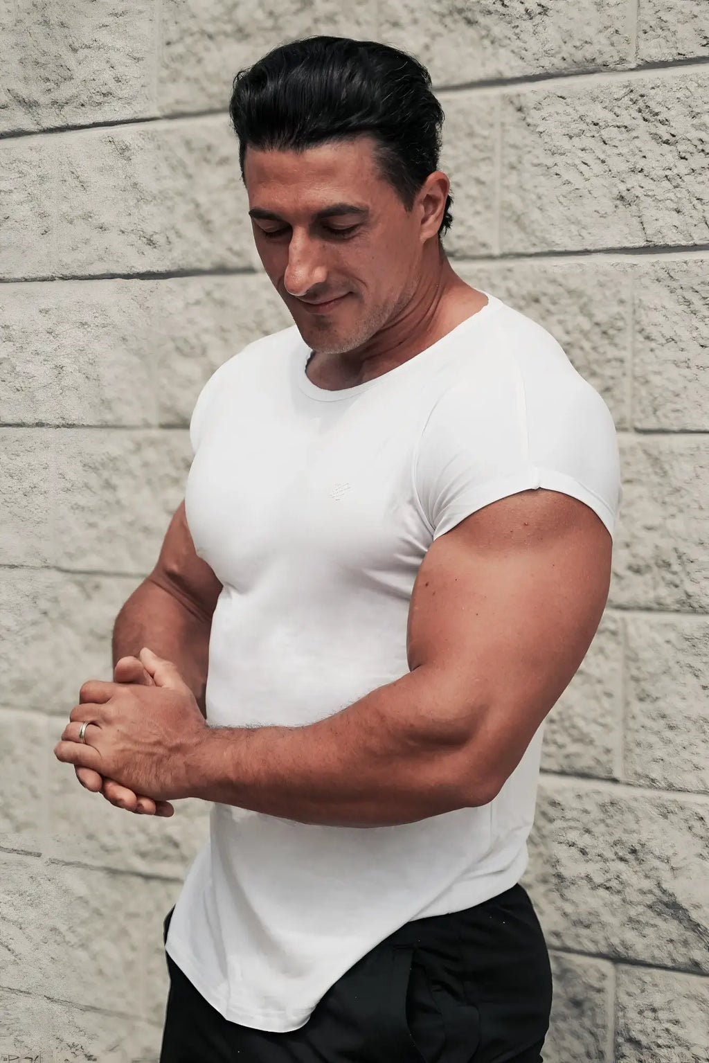 A man wearing a white fitted Jed North Evolve cap sleeve muscle t-shirt 2.0 with a crew neck front view