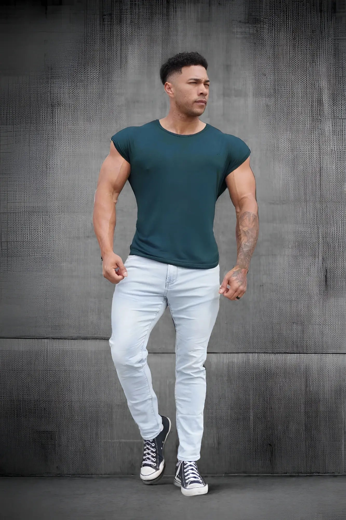 Dark green sleeveless athletic tee with crew neckline and fitted cut from jed north evolve men’s collection