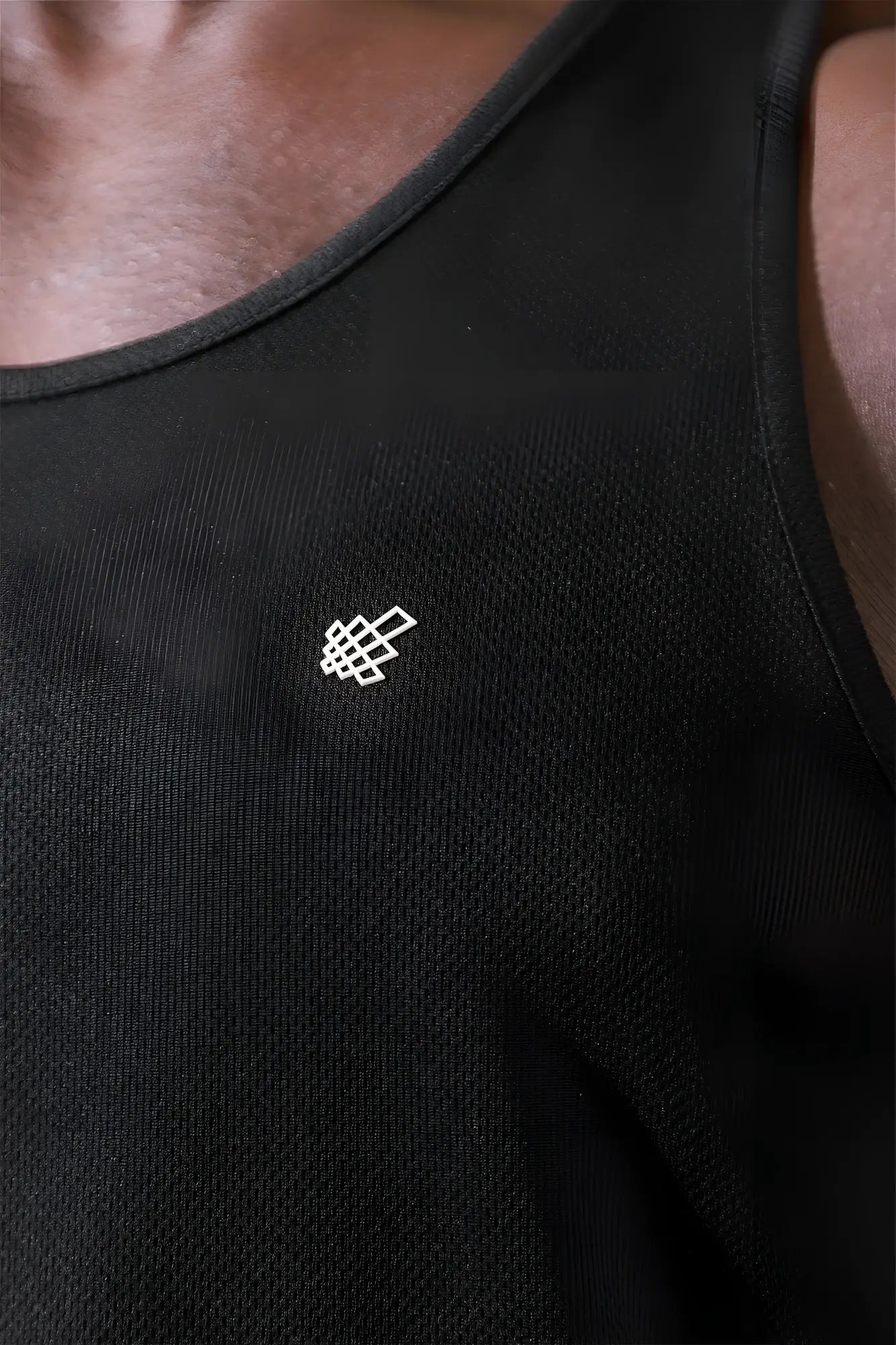 Black Jed North fast-dry bodybuilding workout stringer tank top with subtle white geometric logo embroidered on chest