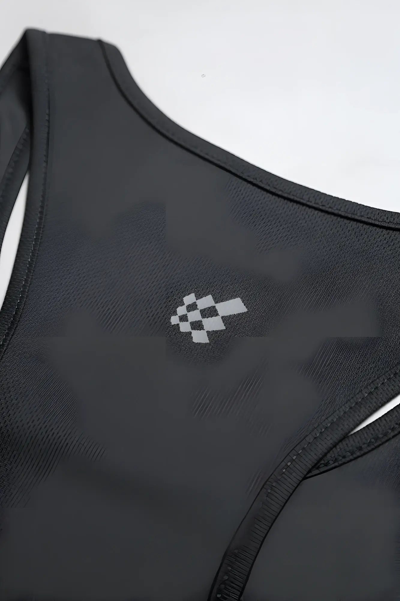 Black racerback fast-dry bodybuilding workout stringer sports bra with subtle gray checkered flag logo on chest