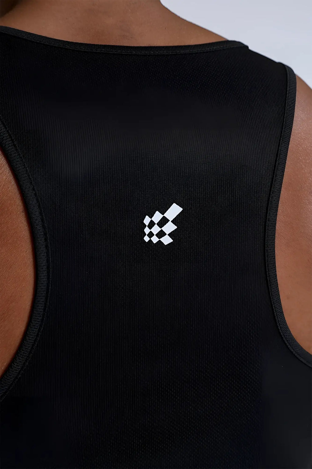 Back view of black fast-dry bodybuilding workout stringer tank top with white checkered flag usa logo