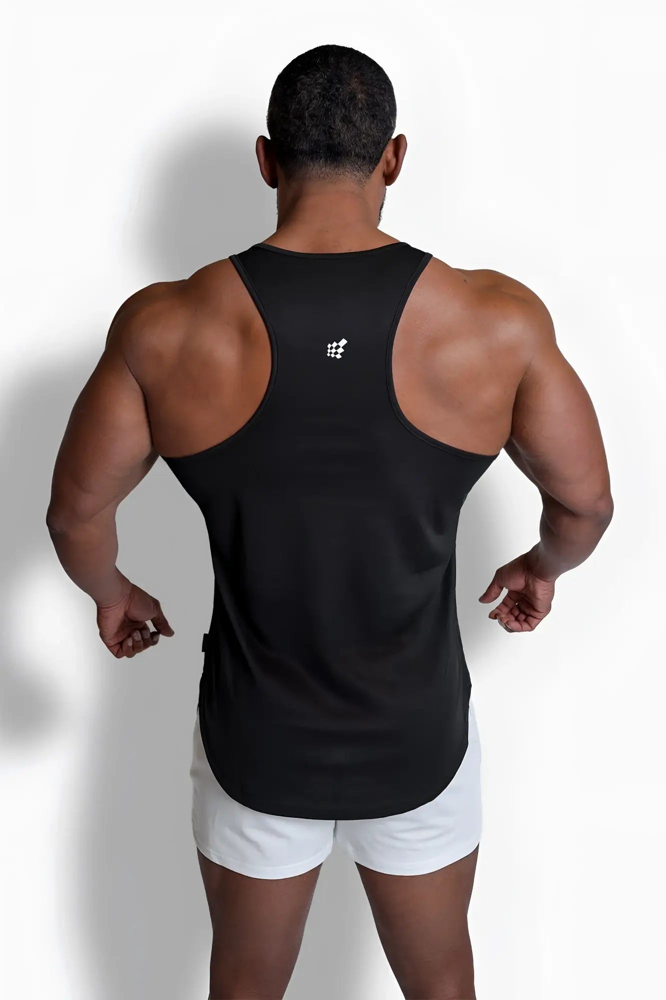 Back side of a black fast-dry bodybuilding workout stringer tank top with a small white usa logo on upper back