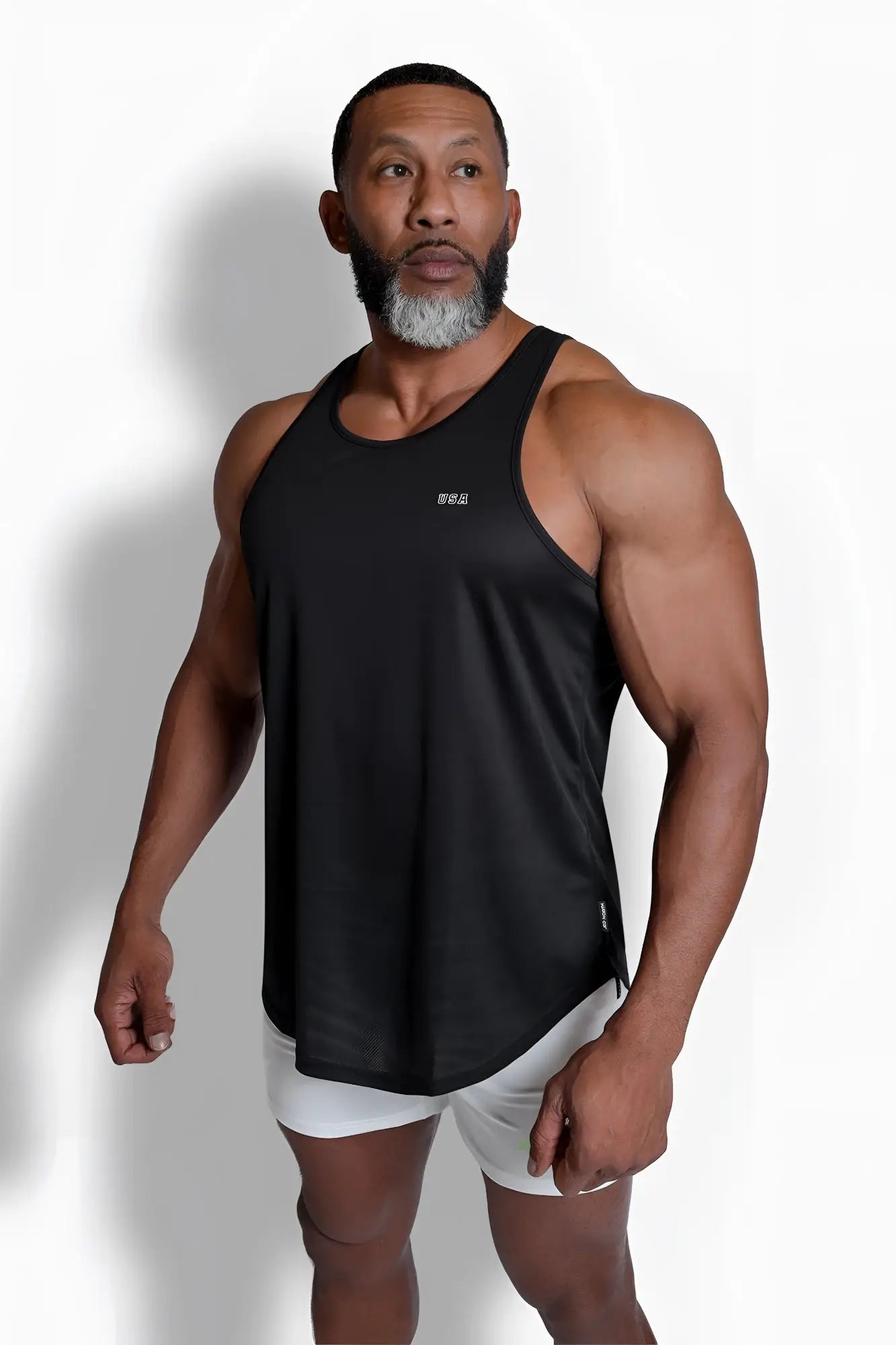 Black sleeveless fast-dry bodybuilding workout stringer tank top with subtle usa logo on the chest