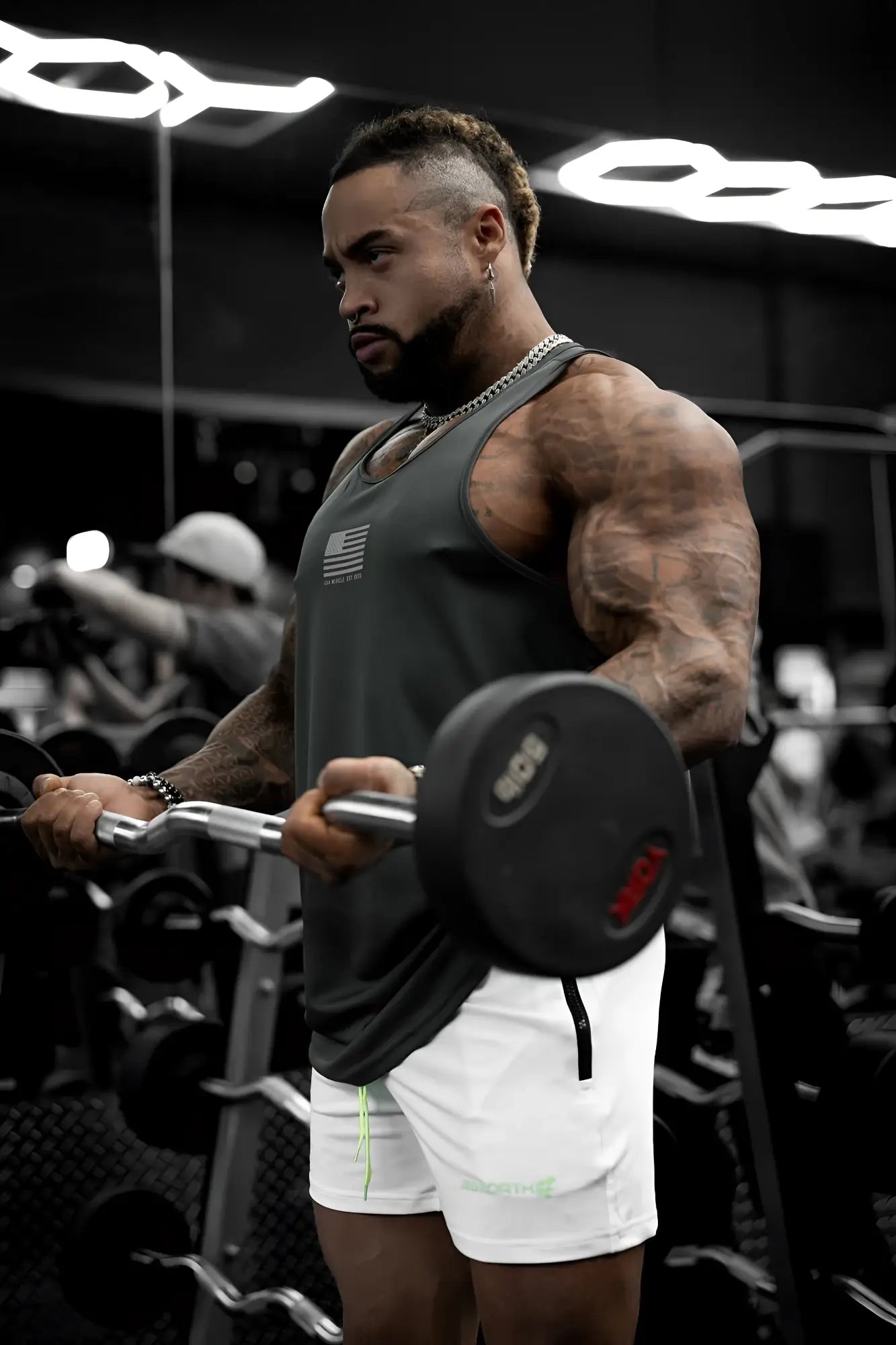 Black weight plate with red and white markings designed for fast-dry bodybuilding workout stringer usa use