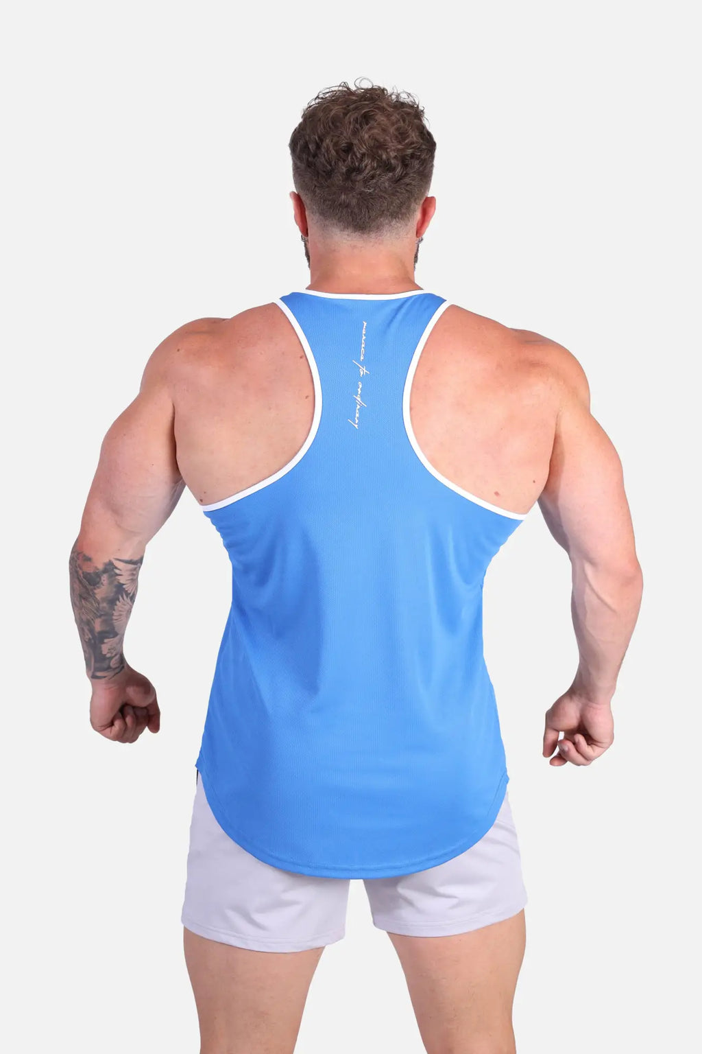 Back view of jed north fast-dry bodybuilding workout stringer in vibrant blue with white trim and subtle script logo