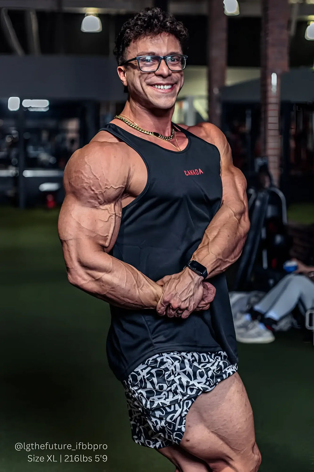 Black fast-dry bodybuilding workout stringer tank top with canada embroidered in red on the chest