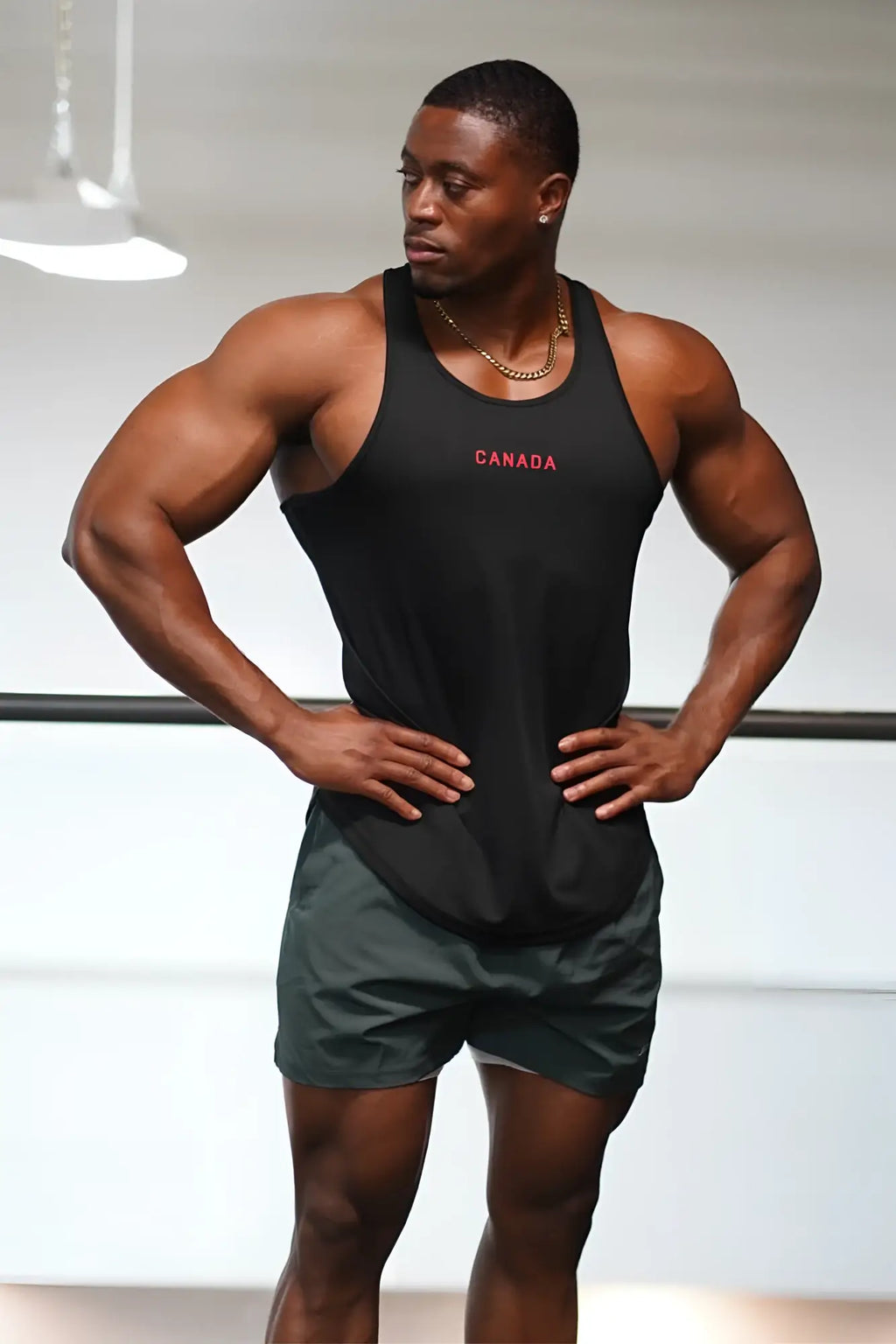 Fast-dry black bodybuilding workout stringer tank top with canada embroidered in red for gym and training