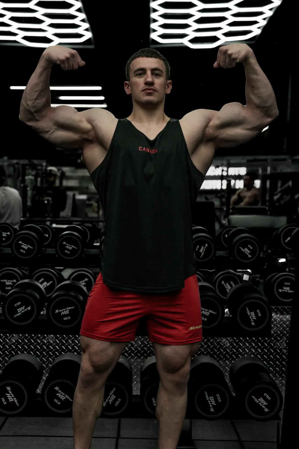 Fast-dry black bodybuilding workout stringer tank top with red canada print for active training and gym use