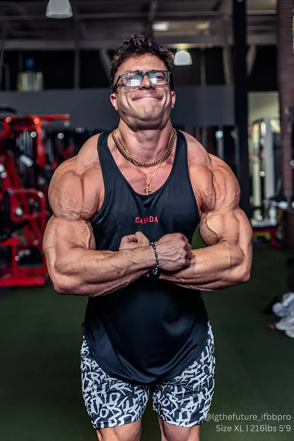Black fast-dry bodybuilding workout stringer tank top with canada printed in red across the chest
