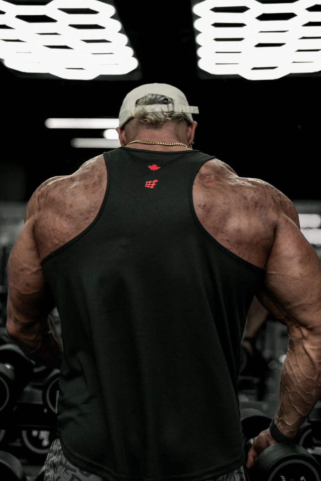 Black fast-dry bodybuilding workout stringer with red oh canada logo on the back