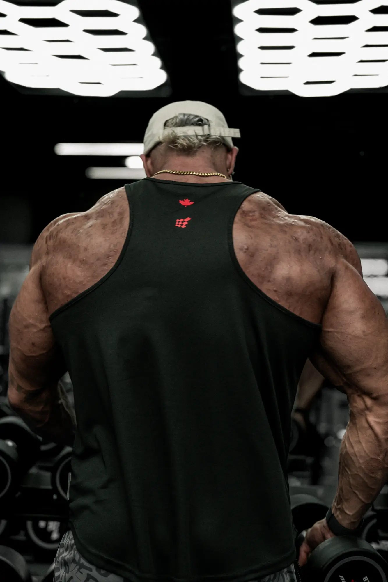 Black fast-dry bodybuilding workout stringer with red oh canada logo on the back
