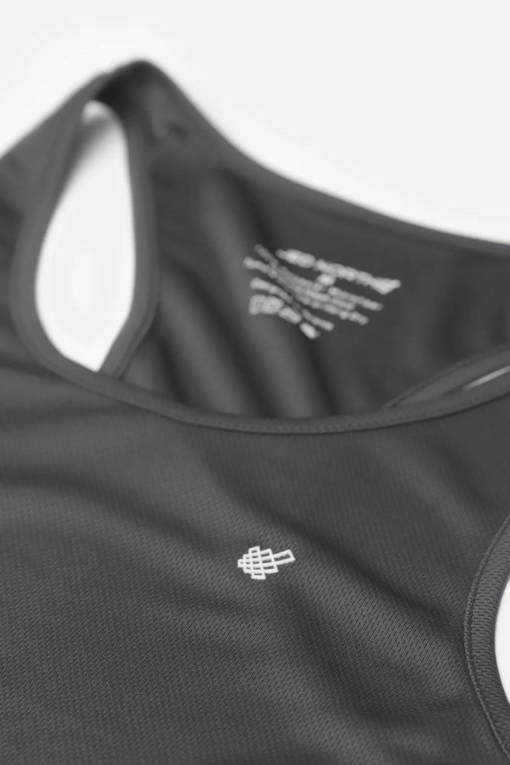 Black charcoal jed north fast-dry bodybuilding workout stringer tank top with subtle white geometric logo on chest
