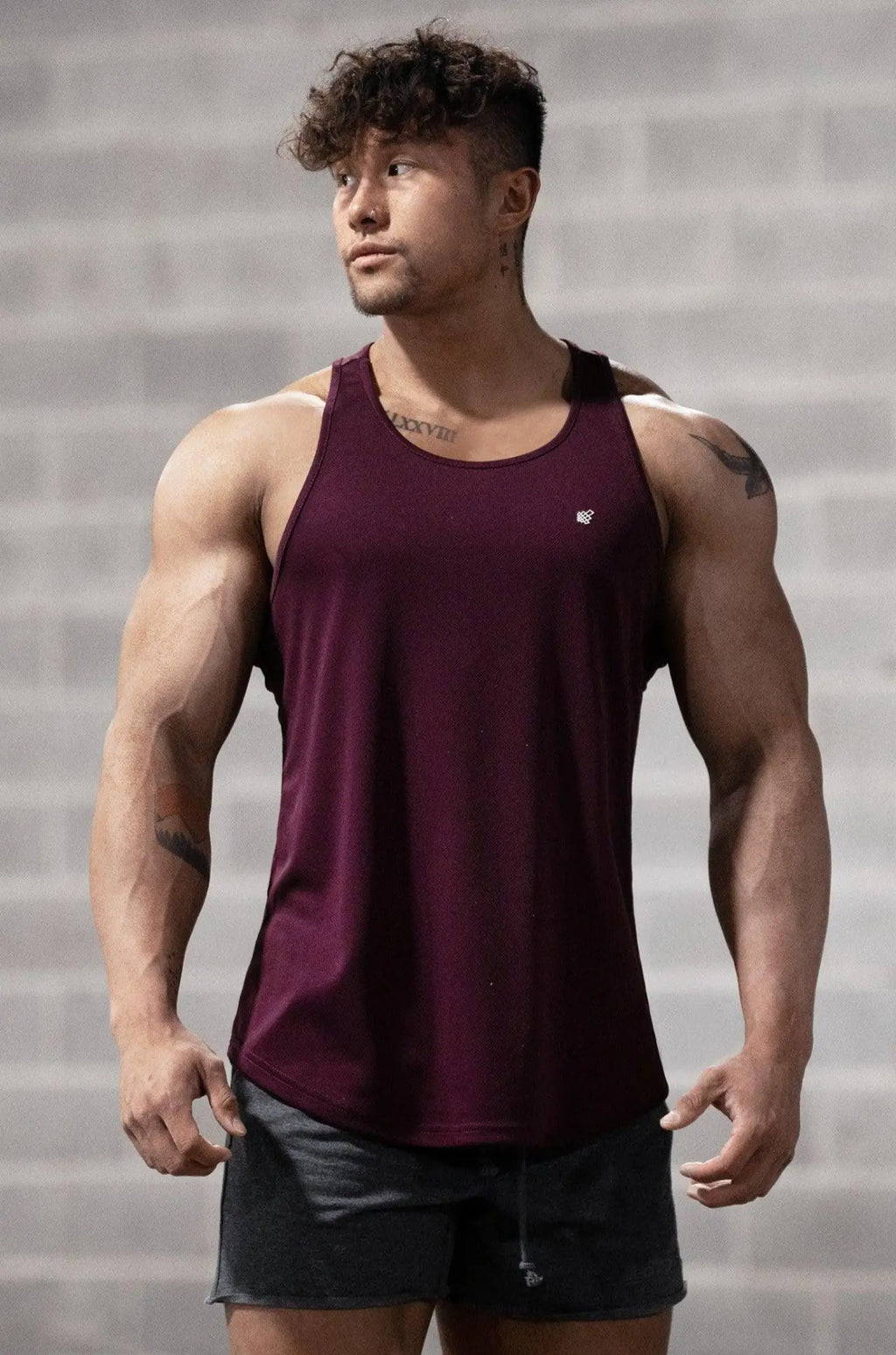 Maroon jed north fast dry bodybuilding workout stringer tank top with subtle logo on upper left chest