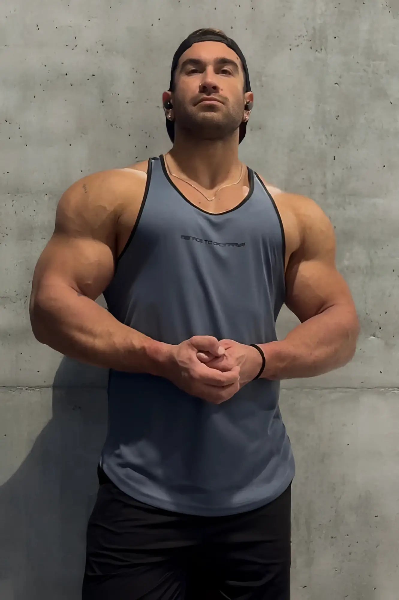 A gray jed north fast-dry bodybuilding workout stringer tank top with black trim and small chest logo