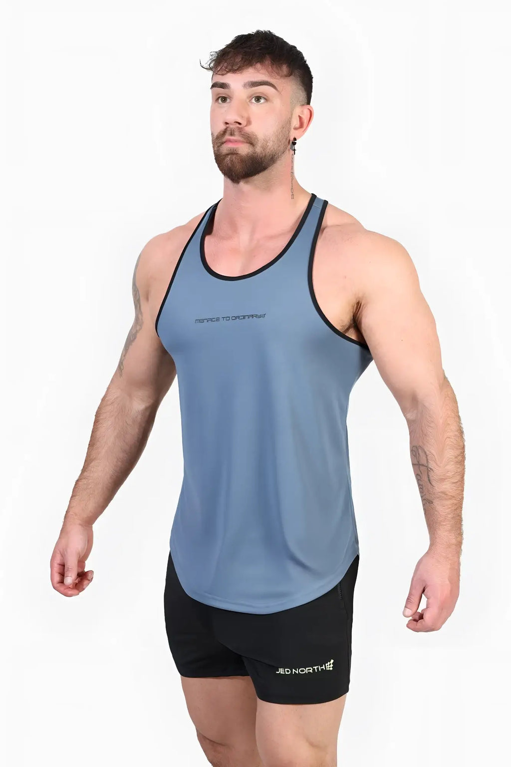 Blue athletic tank top with black trim and subtle trust to overcome text for bodybuilding workouts by jed north