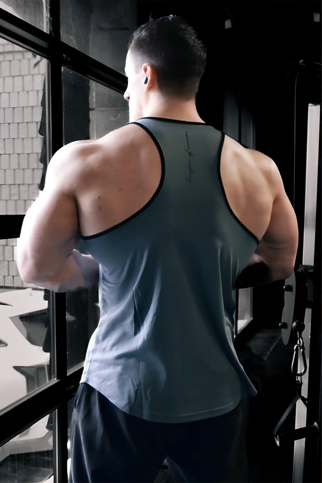 Jed North fast-dry bodybuilding workout stringer tank top in dark gray with black trim, sleeveless and moisture-wicking