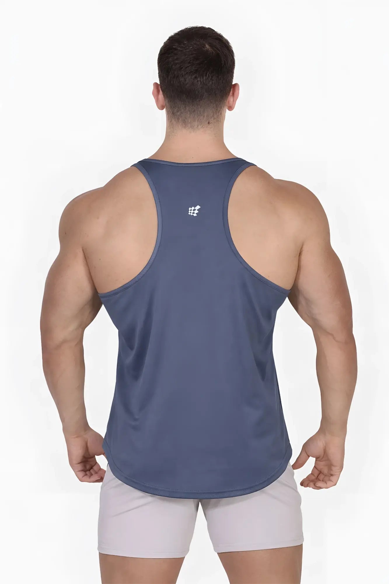 Back view of a navy blue fast-dry bodybuilding workout stringer tank top with a small gray usa logo on upper back