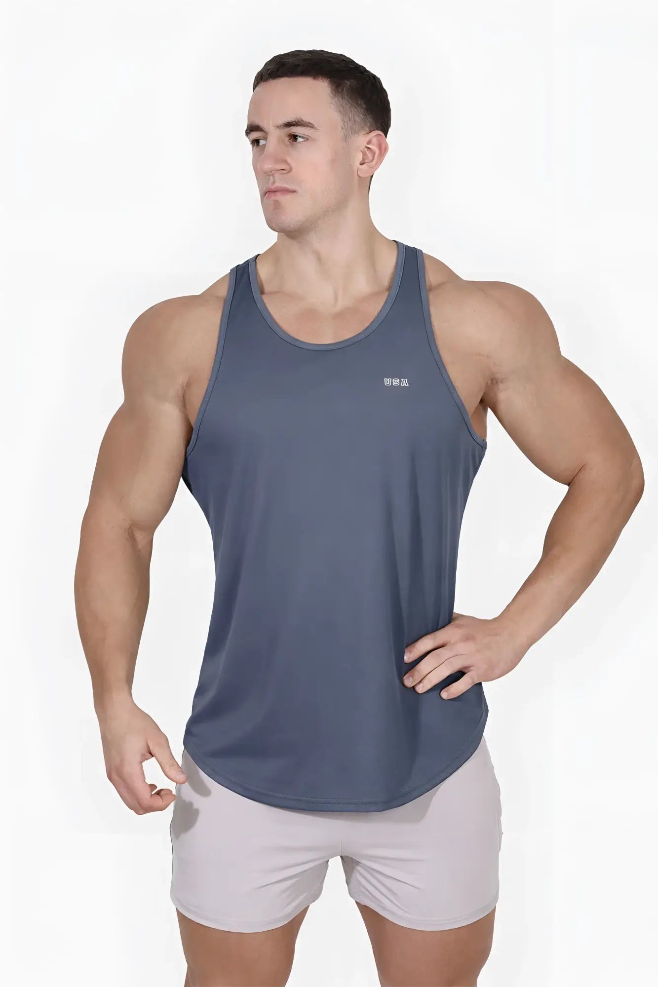 A sleek dark gray fast-dry bodybuilding workout stringer tank top with a subtle USA logo on the chest