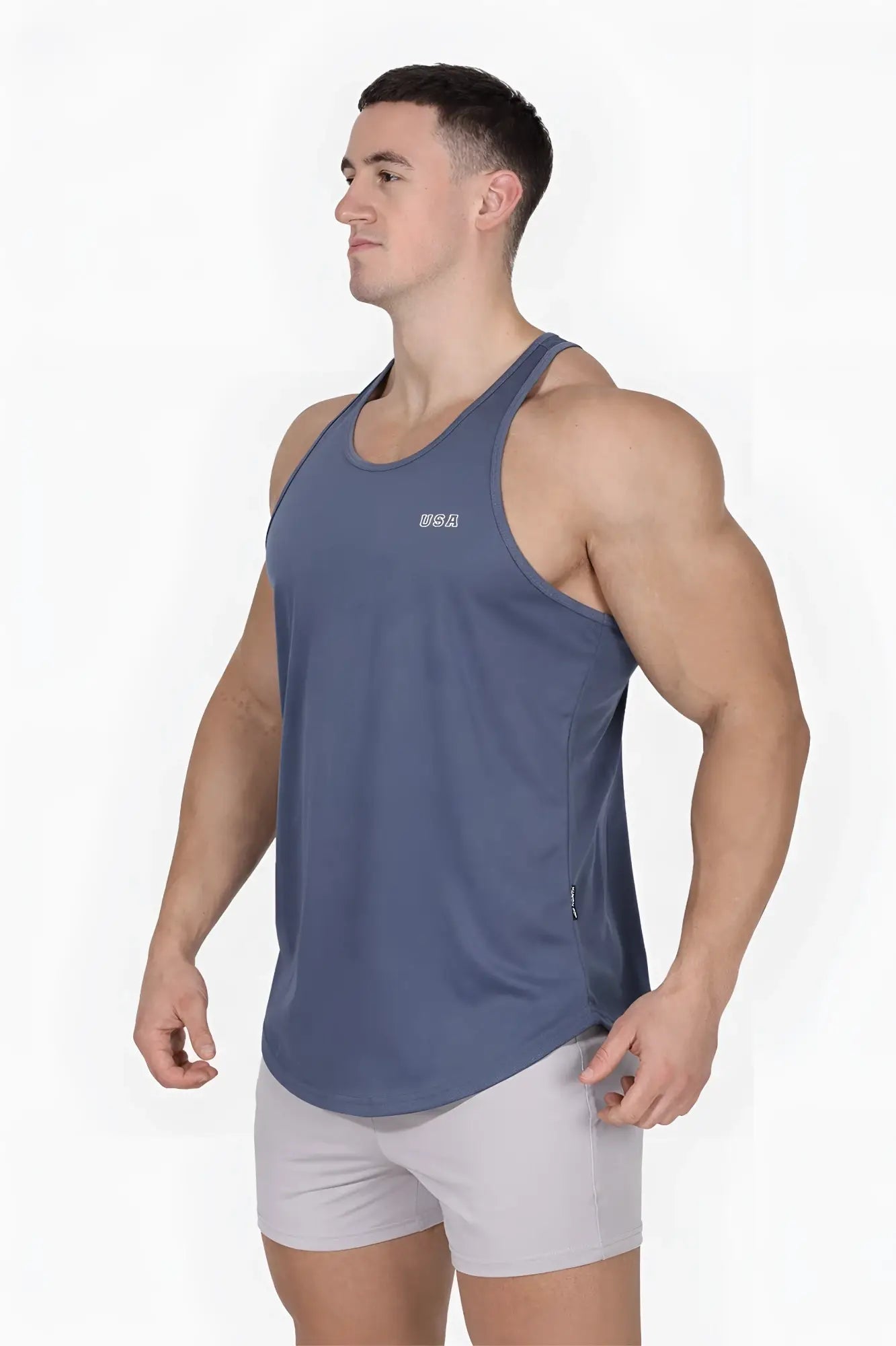 A sleek dark blue fast-dry bodybuilding workout stringer with a subtle usa logo and side pocket for convenience