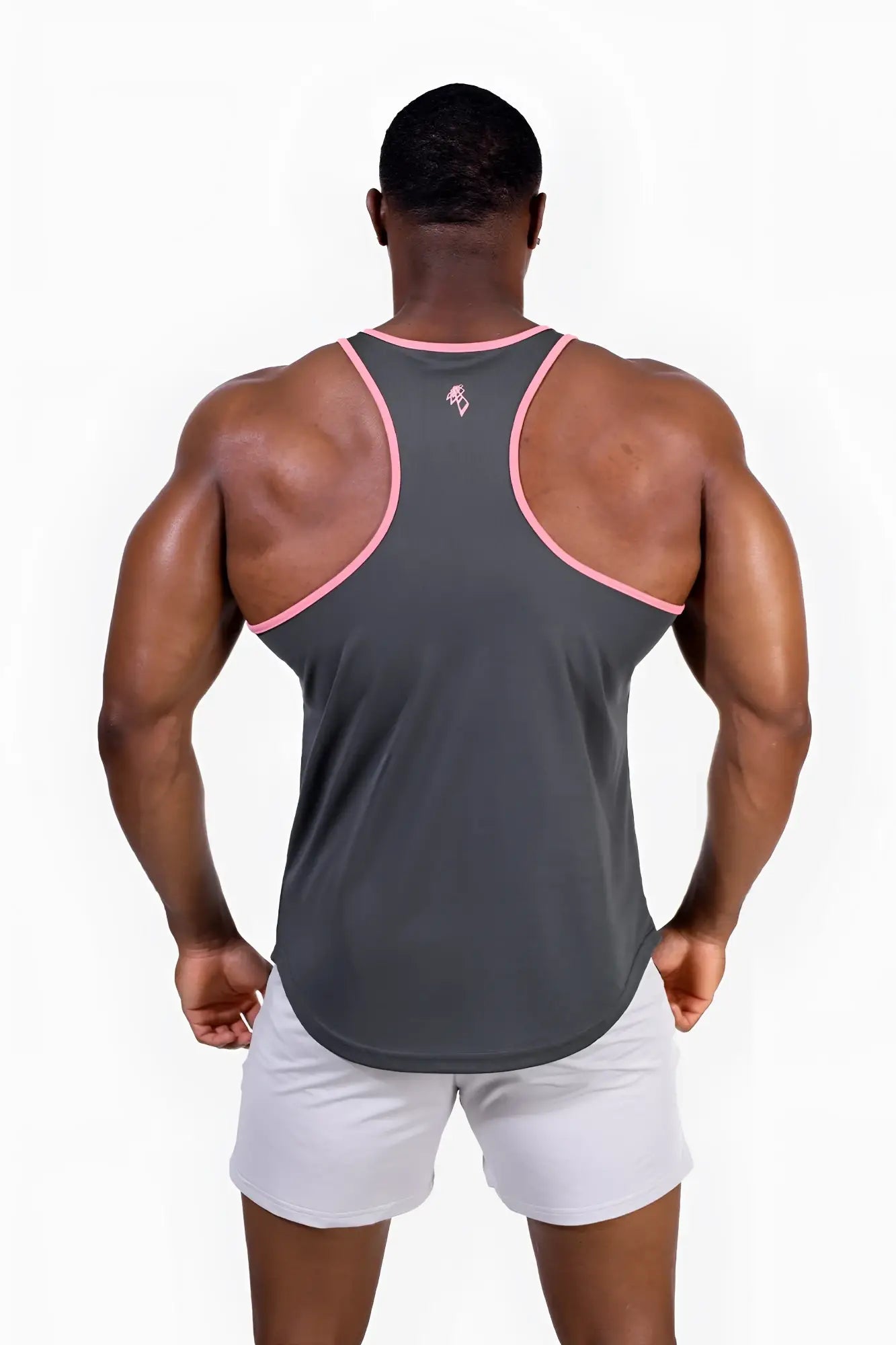 Back view of gray fast-dry bodybuilding workout stringer tank top with pink trim and small upper back logo