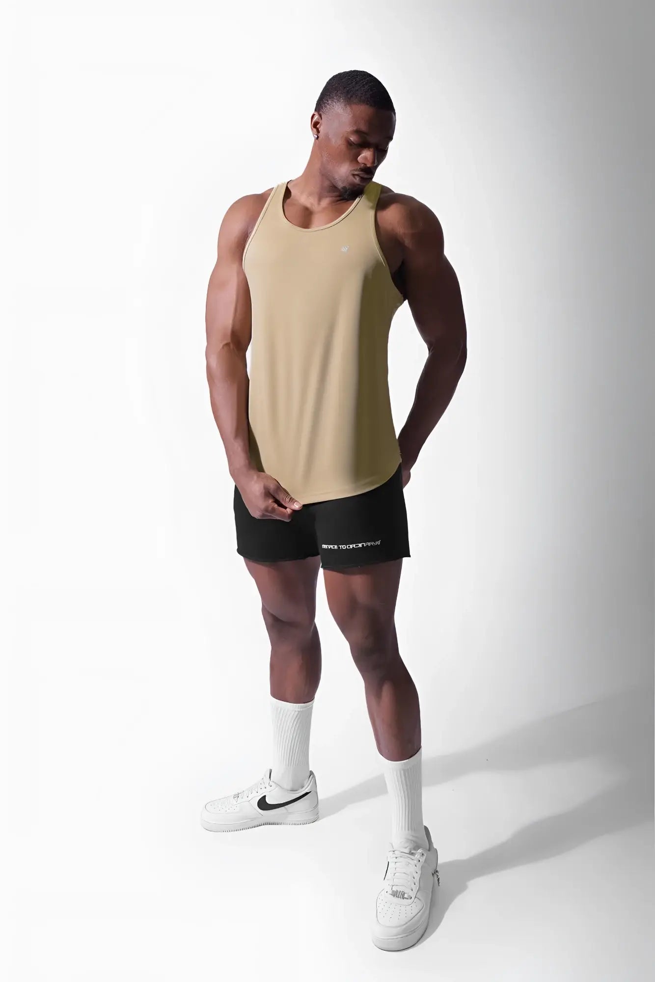 Beige sleeveless jed north fast-dry bodybuilding workout stringer with a fitted design for khaki-colored gym use