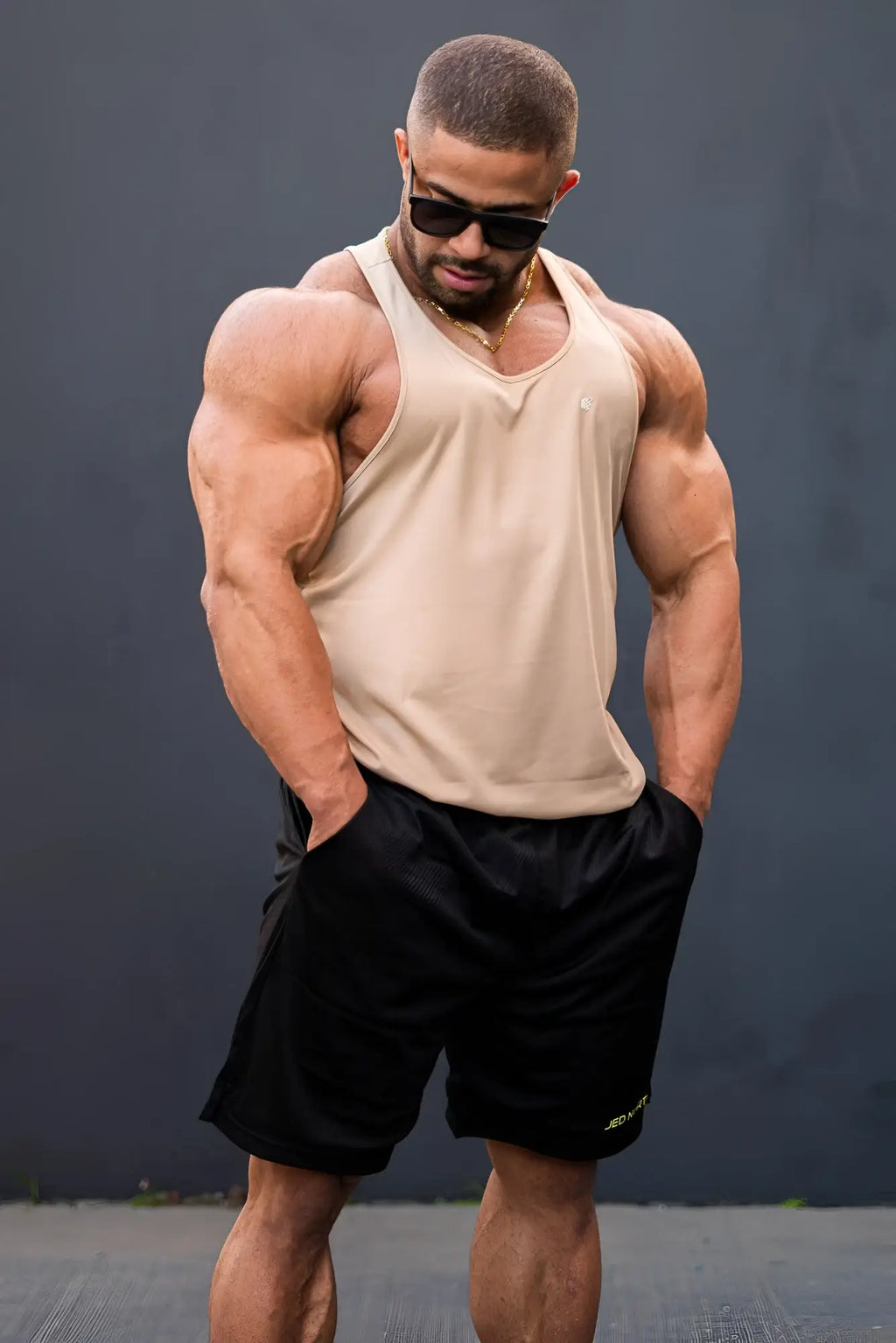 Beige sleeveless jed north fast-dry bodybuilding stringer tank top with v-neckline for workout use