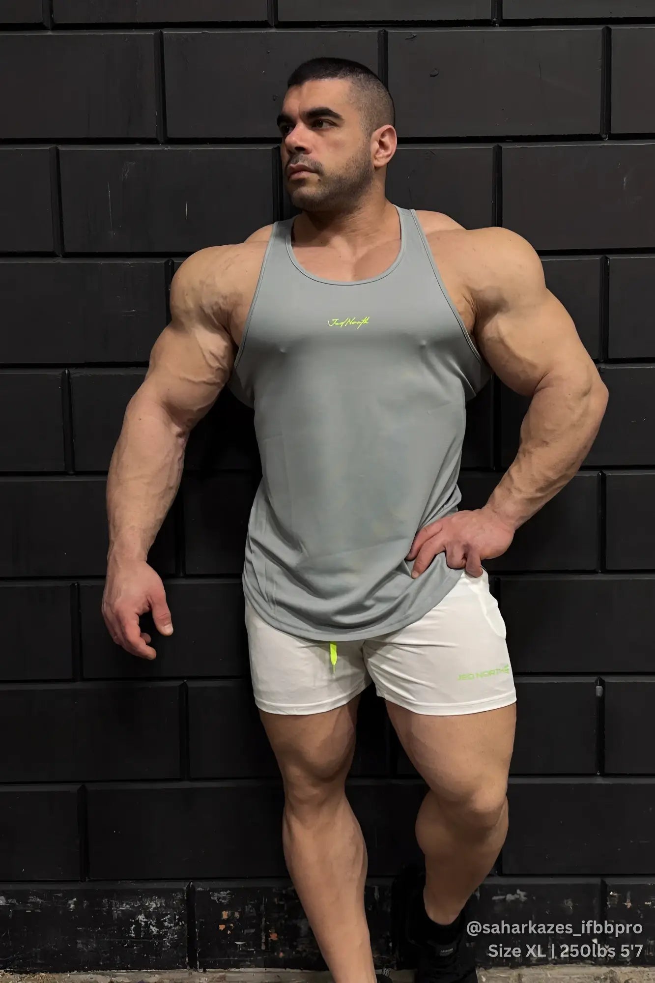 Gray fast-dry bodybuilding workout stringer tank top with small neon yellow logo on the chest