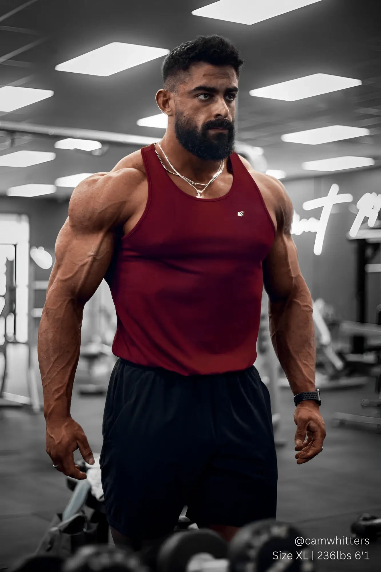 A maroon jed north fast dry bodybuilding workout stringer tank top with a small chest logo for exercise use
