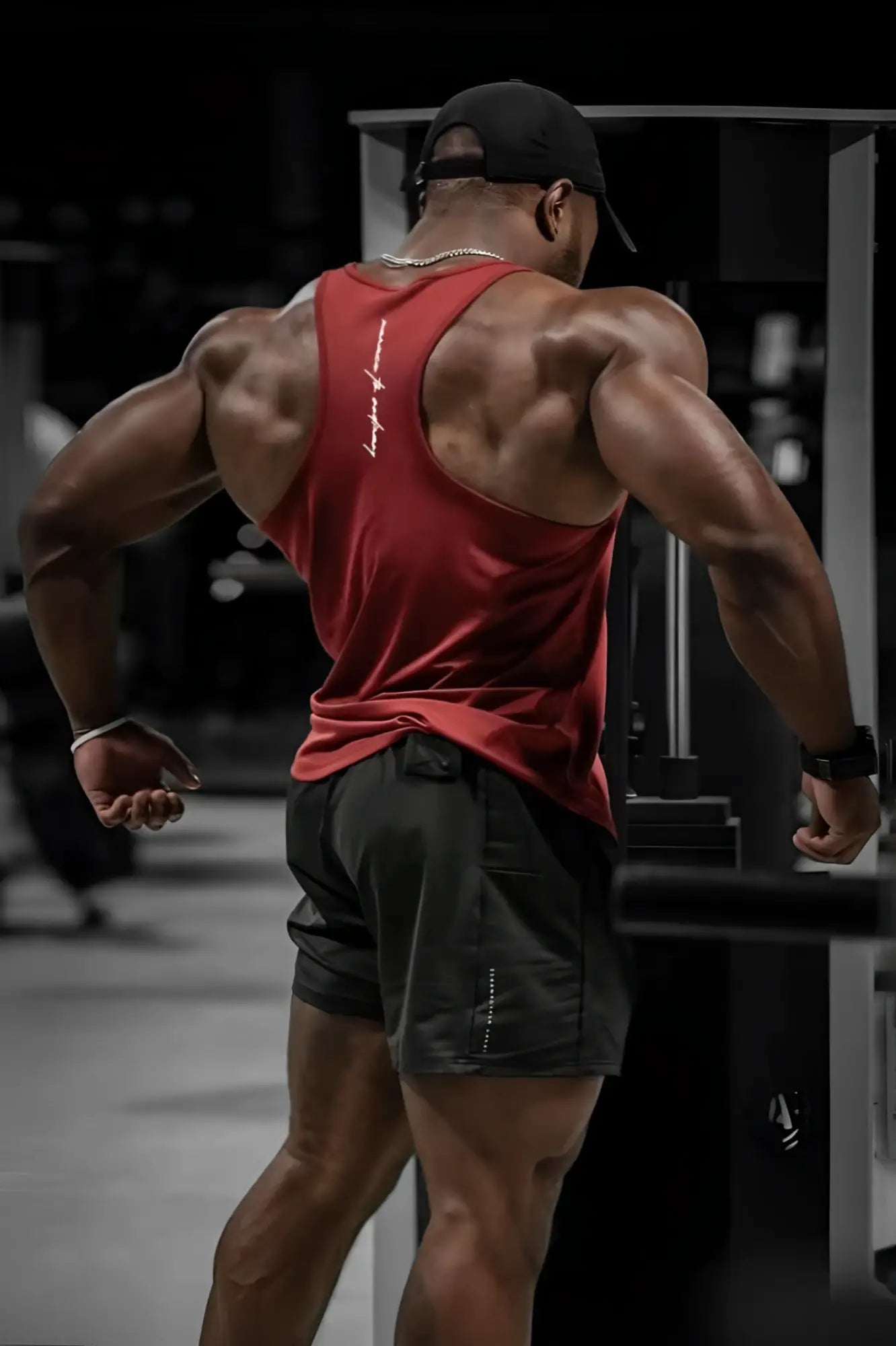 Back view of jed north fast-dry bodybuilding workout stringer tank top in maroon with white logo on back