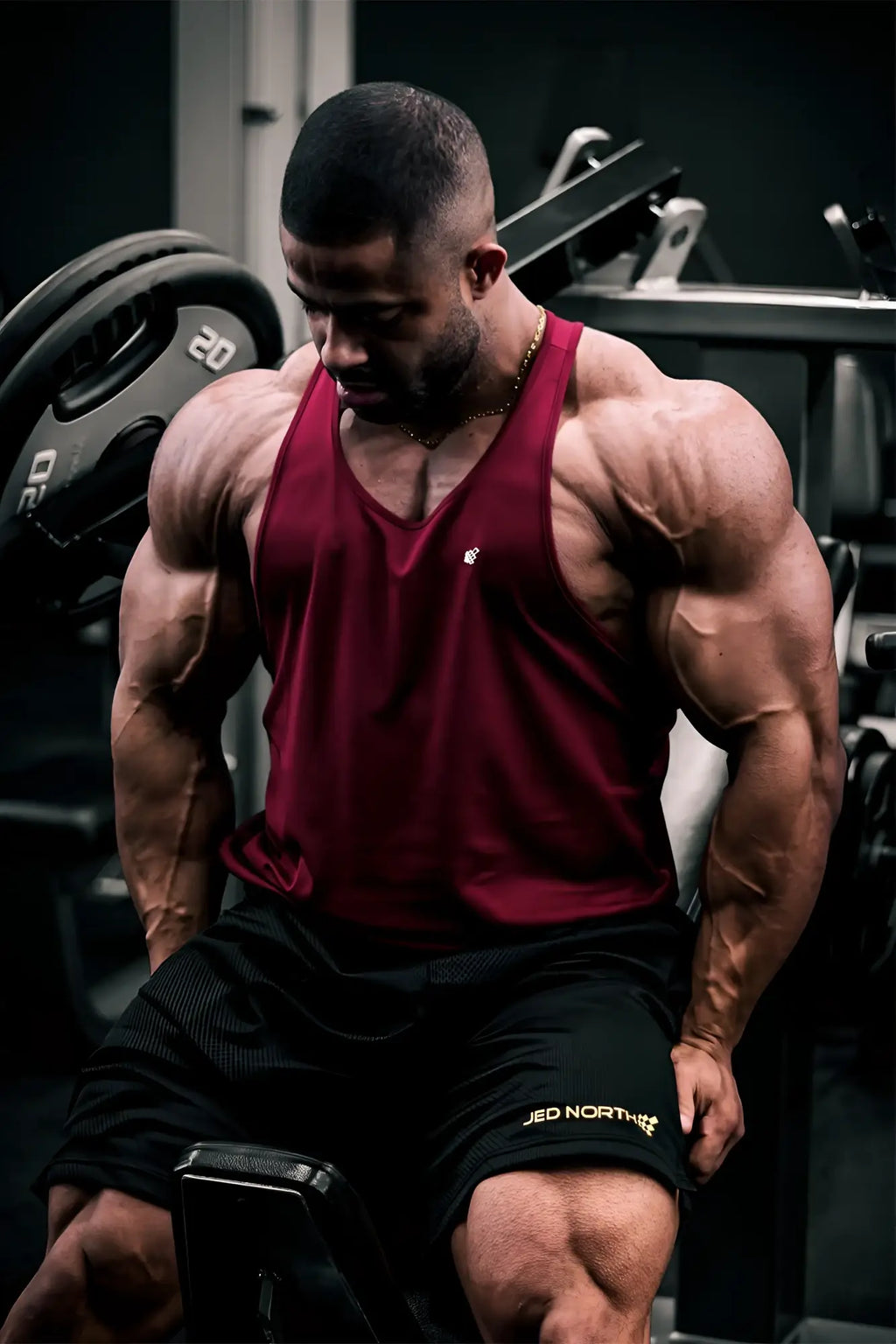Jed North fast-dry bodybuilding workout stringer in maroon sleeveless tank top with white logo on chest