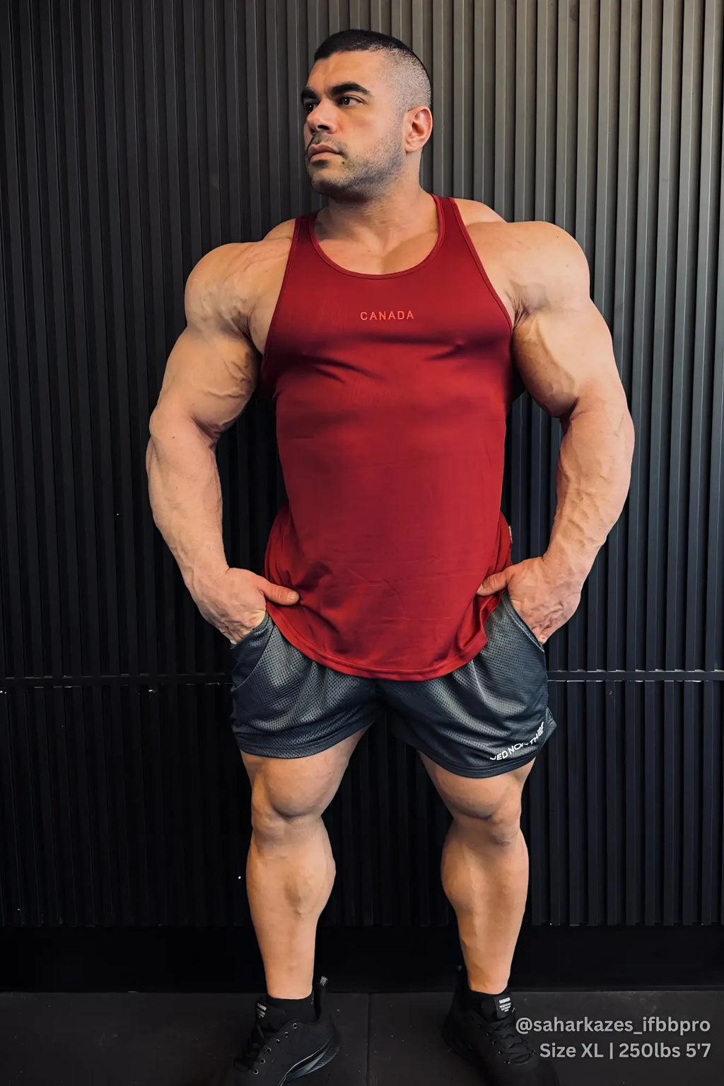 Fast dry bodybuilding workout stringer tank top in maroon with canada logo featuring a fitted athletic cut and ribbed texture