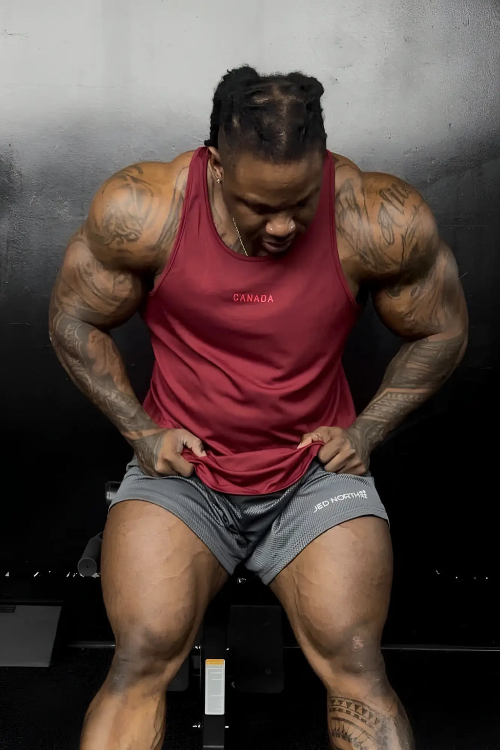 Fast-dry maroon bodybuilding workout stringer tank top with canada logo embroidered in white across the chest