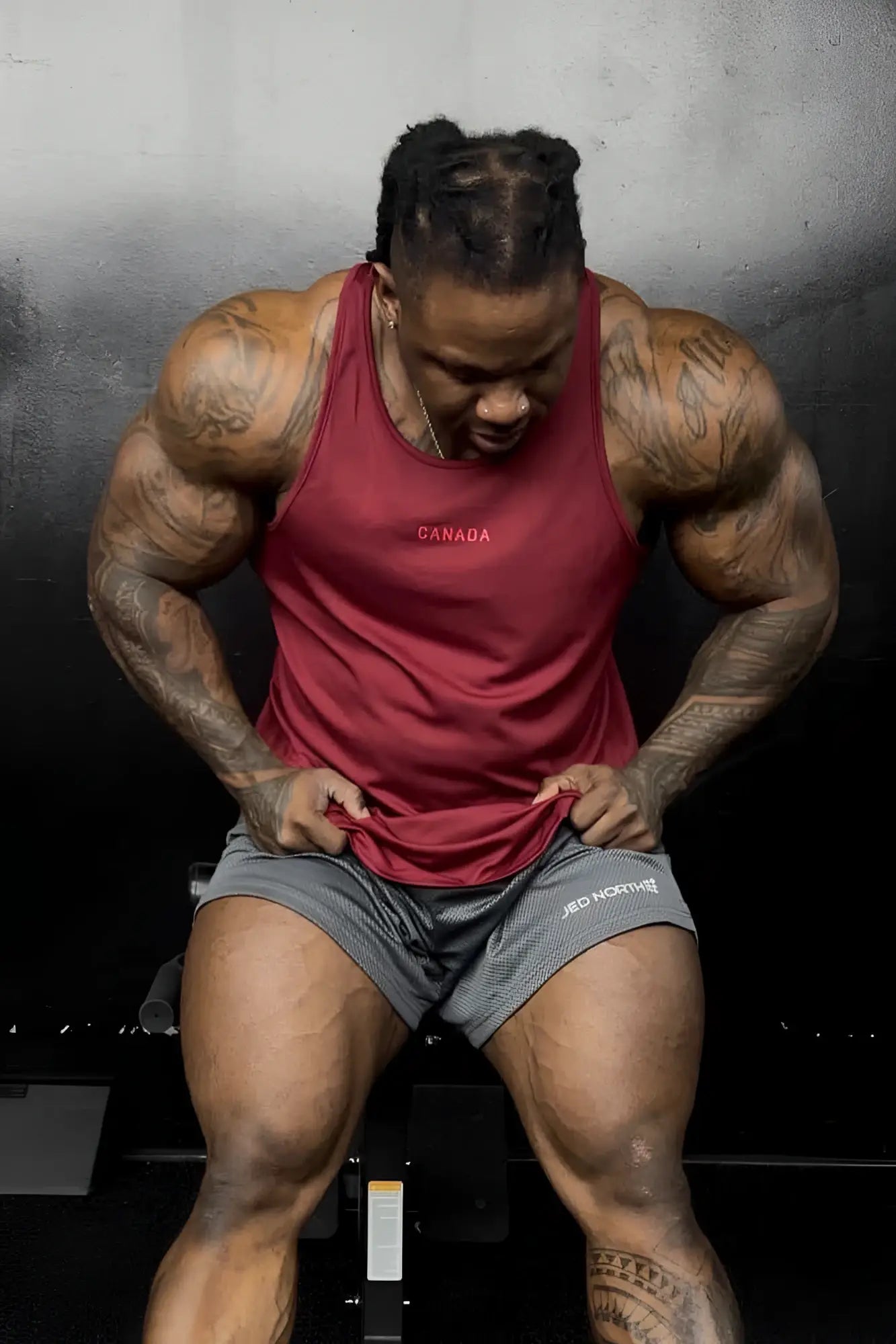 Fast-dry maroon bodybuilding workout stringer tank top with canada logo embroidered in white across the chest