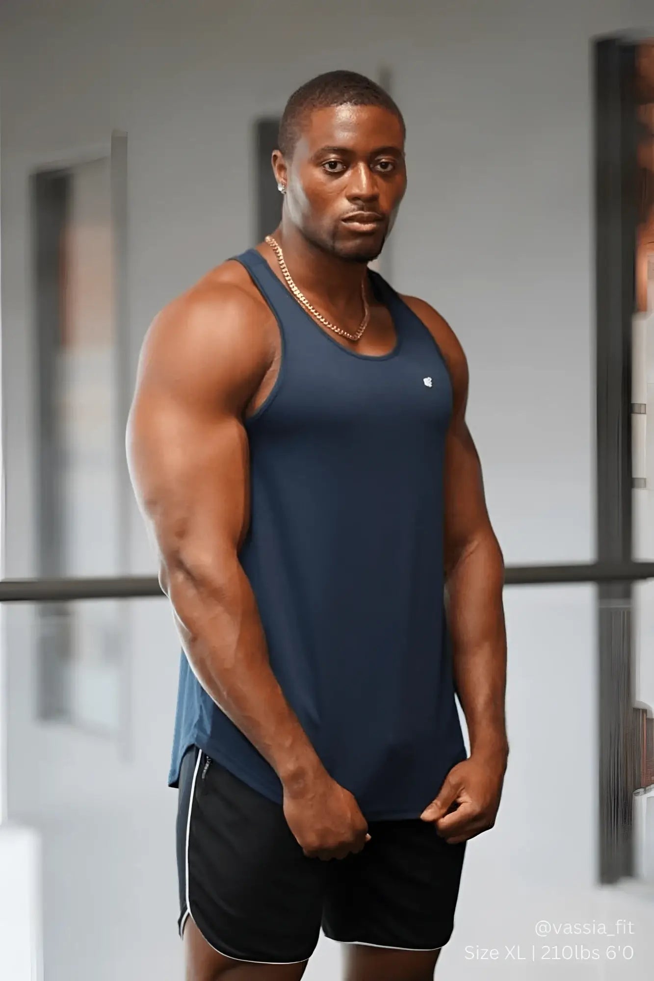 Navy blue sleeveless fast-dry Jed North bodybuilding workout stringer with small white logo on left chest