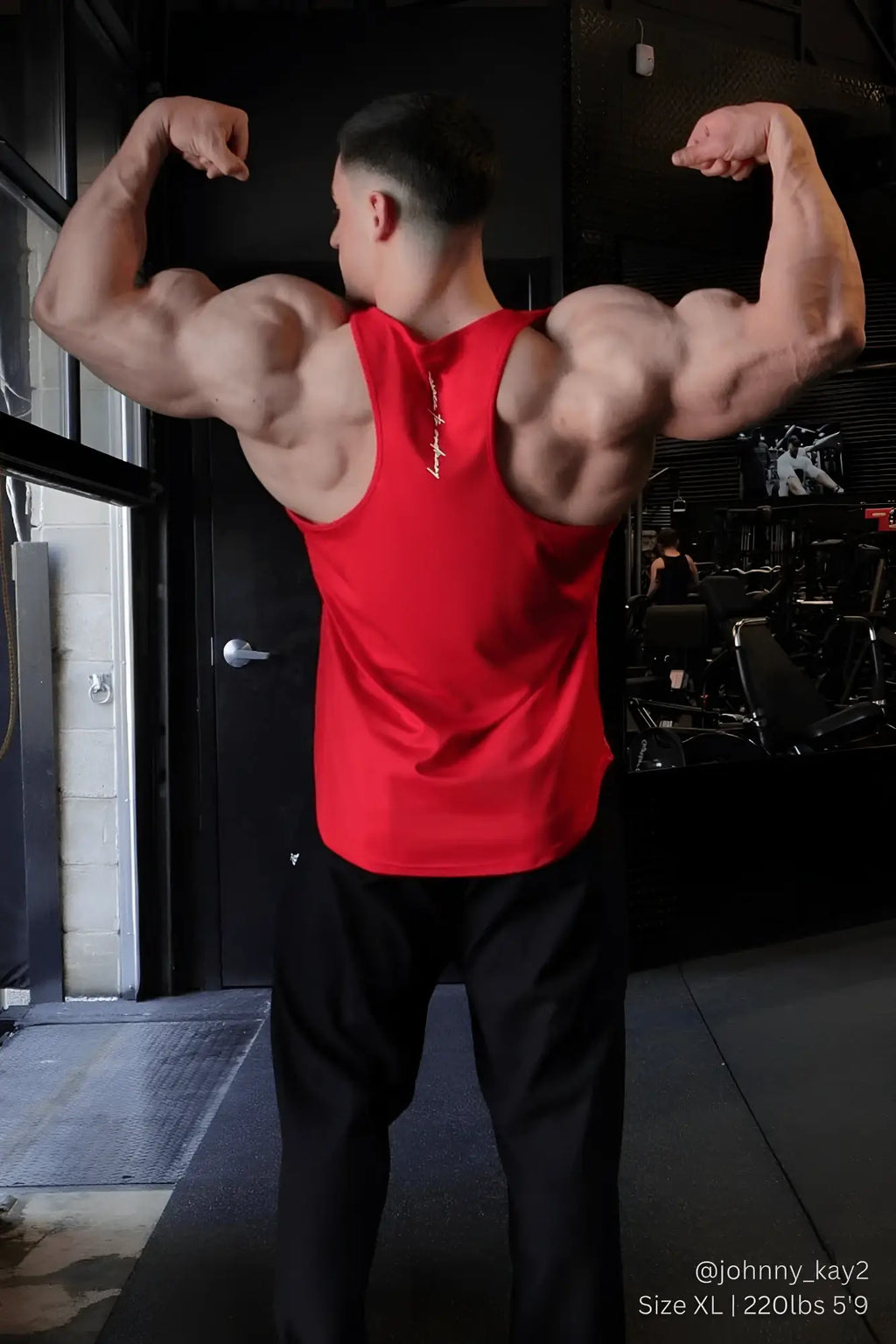 Red sleeveless fast-dry bodybuilding workout stringer tank top with white stitching along the neckline