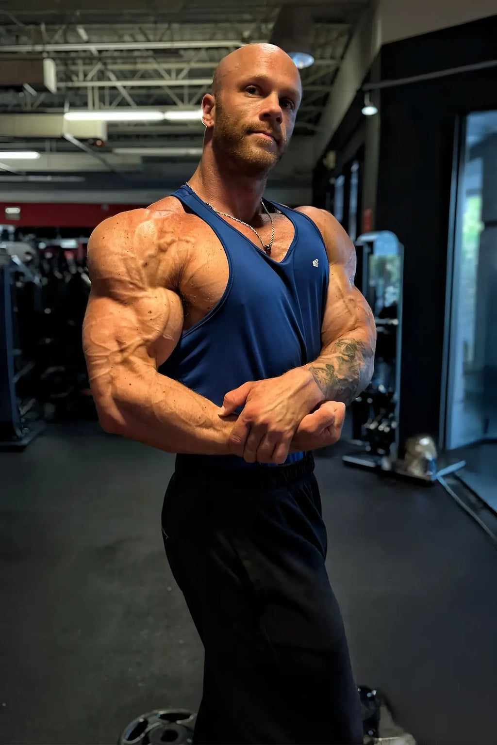 Blue royal blue fast-dry bodybuilding workout stringer tank top designed for athletic performance and comfort